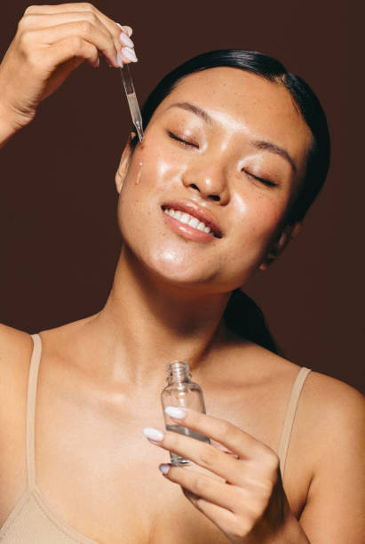 Lightweight facial serum being applied to oily skin for hydration and oil control